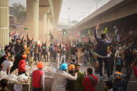 DELHI, INDIA - 2021/01/26: Protesters chant slogans at the Tikri border during the demonstration. Farmers protesting against agricultural reforms breached barricades and clashed with police in the capital on the India's 72nd Republic Day. The police fired tear gas to restrain them, shortly after a convoy of tractors trundled through the Delhi's outskirts. (Photo by Manish Rajput/SOPA Images/LightRocket via Getty Images)