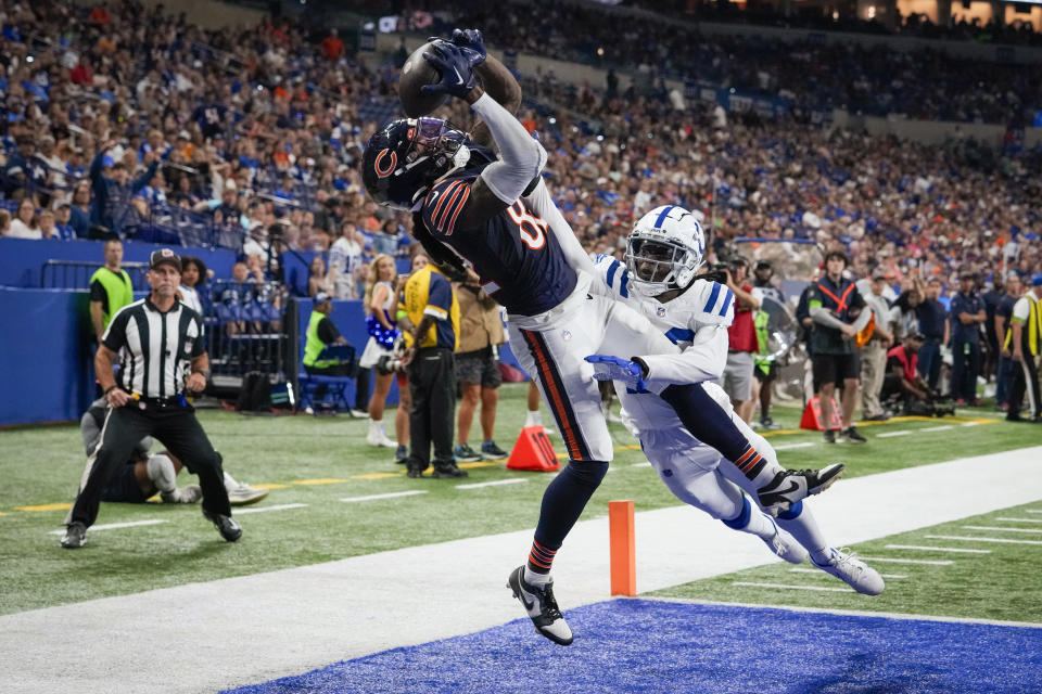 Chicago Bears wide receiver Daurice Fountain, left, makes a touchdown reception in front of Indianapolis Colts cornerback Darius Rush during the second half of an NFL preseason football game in Indianapolis, Saturday, Aug. 19, 2023. (AP Photo/Michael Conroy)