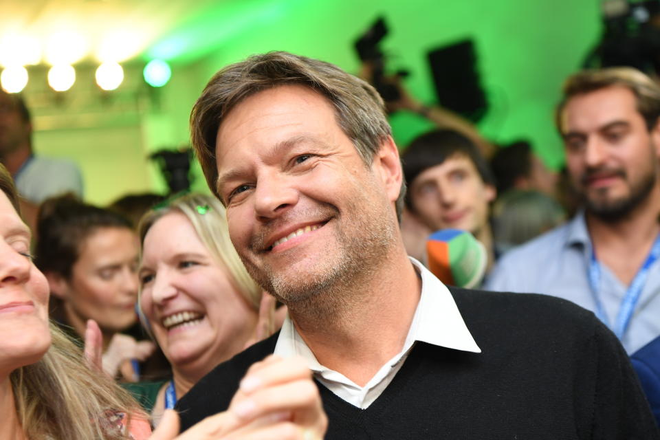 Robert Habeck, chairman of the Green party, smiles after the first exit polls for the Bavarian state election in Munich, southern Germany, Sunday, Oct. 14, 2018. (Sven Hoppe/dpa via AP)