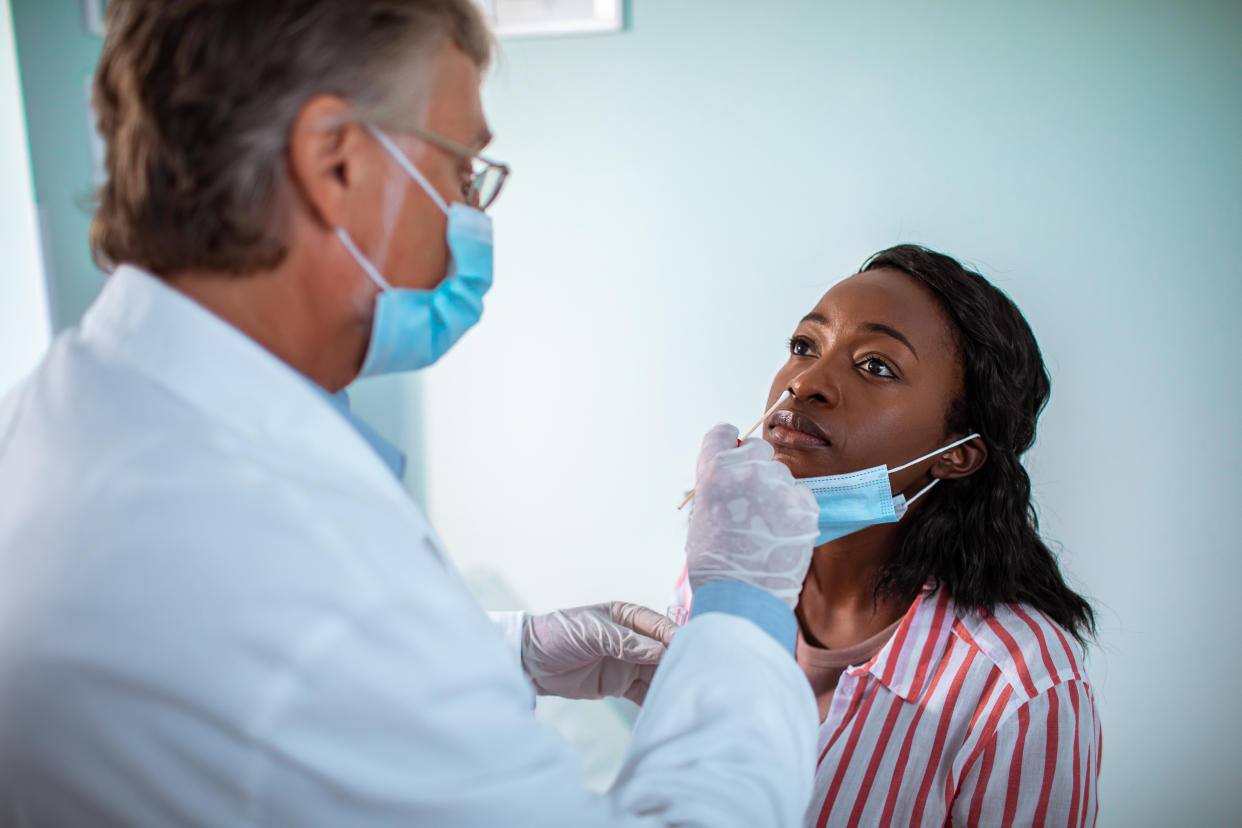 Close up of a young woman getting tested at the doctors office