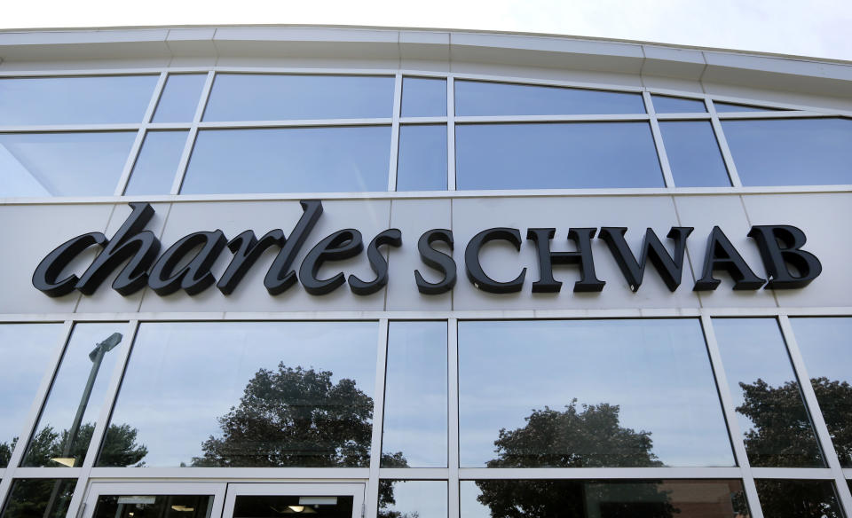 This Monday, July 18, 2016, photo shows a branch of Charles Schwab, in Burlington, Mass. Charles Schwab reports financial results on Monday, Oct. 17, 2016. (AP Photo/Elise Amendola)