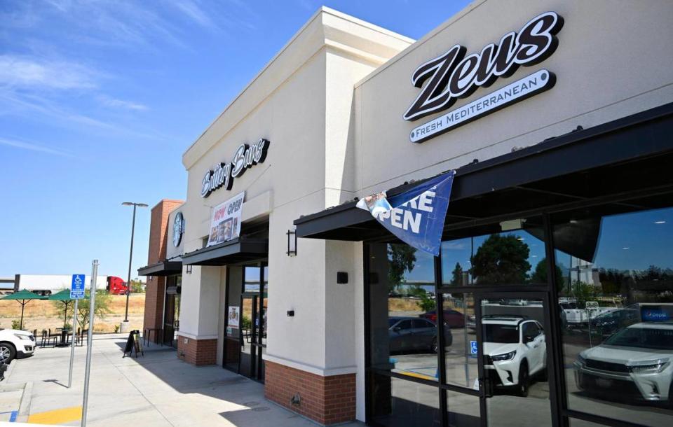 Buttery Buns and Zeus Fresh Mediterranean have opened side by side with the same owners and a shared dining room, located along Freeway 99, background, at North Avenue just south of Fresno. Photographed Wednesday, June 21, 2023.