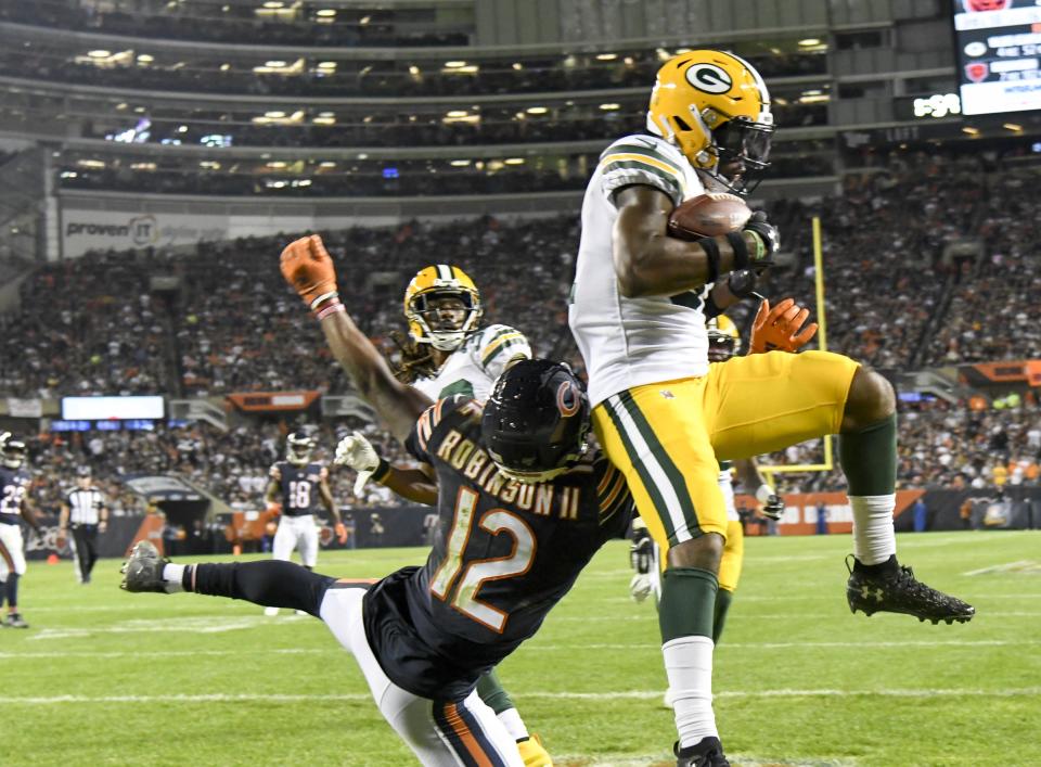 Green Bay Packers' Adrian Amos intercepts a pass during the second half of an NFL football game against the Chicago Bears Thursday, Sept. 5, 2019, in Chicago. The Packers won 10-3. (AP Photo/David Banks)
