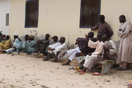 Refugees gather in an internally displaced persons (IDP) camp, that was set up for Nigerians fleeing the violence committed against them by Boko Haram militants, at Wurojuli, Gombe State, September 1, 2014. REUTERS/Samuel Ini