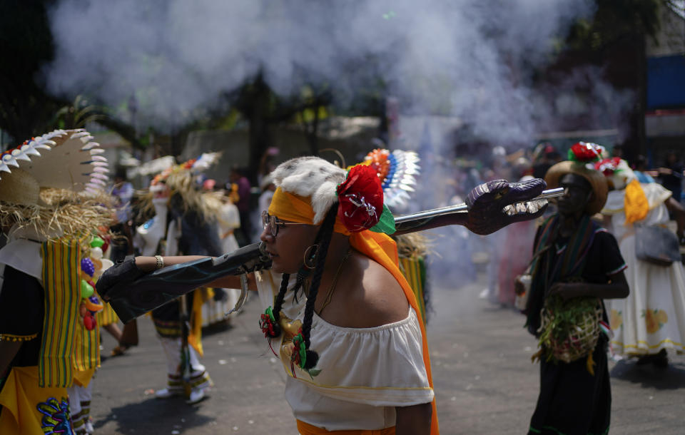 A man dressed as a revolutionary Zacapoaxtla Indigenous soldier marches during the re-enactment of The Battle of Puebla as part of Cinco de Mayo celebrations in the Peñon de los Baños neighborhood of Mexico City, Thursday, May 5, 2022. Cinco de Mayo commemorates the victory of an ill-equipped Mexican army over French troops in Puebla on May 5, 1862. (AP Photo/Eduardo Verdugo)