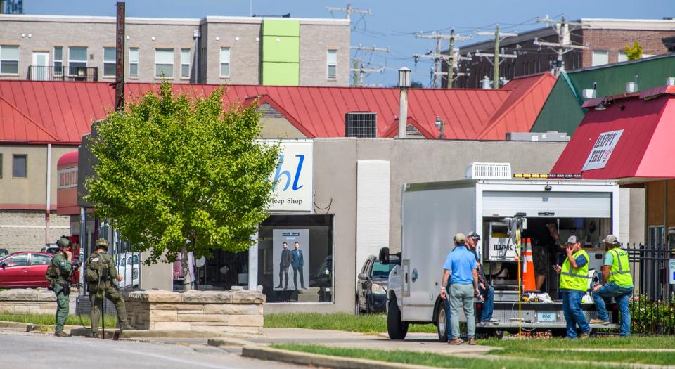 After reports of an armed man in the storm drains, a police search took over Bloomington, Indiana, Sept. 20, 2022.