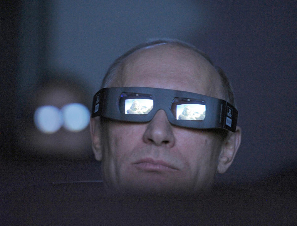 Russian Prime Minister Vladimir Putin wears 3D glasses as he visits Moscow's Planetarium in Moscow, Thursday, April 12, 2012. Putin chaired a meeting with officials on building a new space launchpad in Russia's far east that should become operational by 2018. (AP Photo/RIA-Novosti, Alexei Druzhinin, Government Press Service)