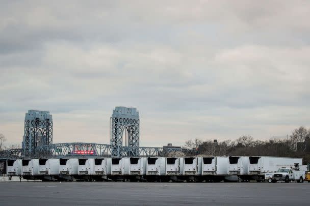 PHOTO: Refrigerated tractor-trailers that can be used by hospitals for makeshift morgues are seen during the coronavirus pandemic, in Icahn Stadium parking lot on Randall&#39;s Island in New York City, New York, March 31, 2020. (Brendan Mcdermid/Reuters)
