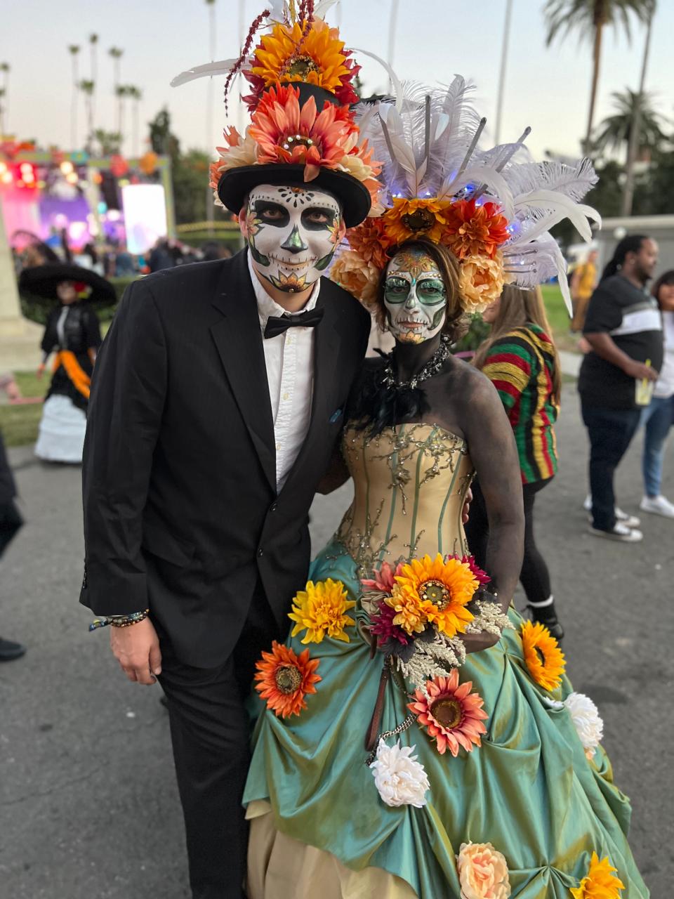 Vasily Filinov of Simi Valley and Stacy Peterson of Desert Hot Springs pose at the Día de Los Muertos celebration at the Hollywood Forever Cemetery in Los Angeles on Saturday, Oct. 28, 2023.