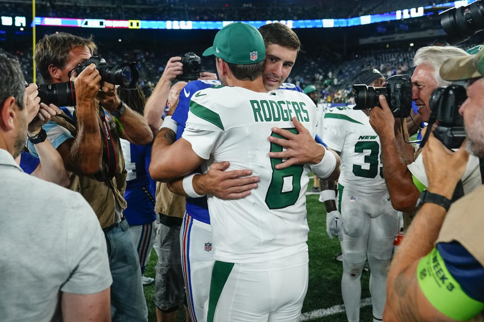 New York Jets quarterback Aaron Rodgers (8) greets New York Giants quarterback Daniel Jones after an NFL preseason football game, Saturday, Aug. 26, 2023, in East Rutherford, N.J. (AP Photo/Frank Franklin II)