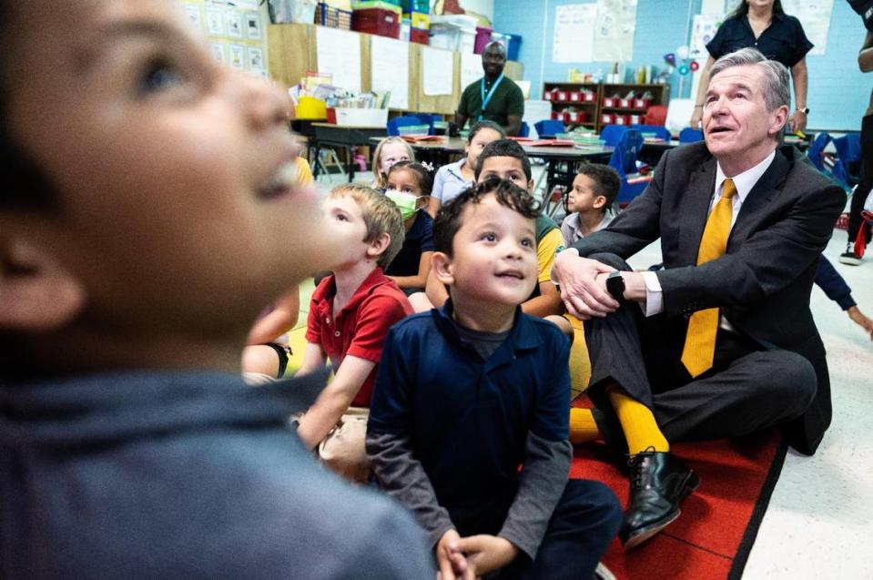 Gov. Roy Cooper visits with students as he tours Huntingtowne Farms Elementary School in Charlotte, N.C., on Wednesday, May 24, 2023.