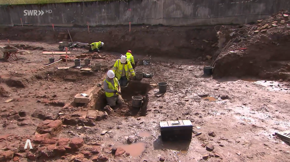 Archaeologists excavate the temple site.