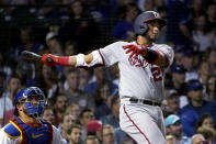 Washington Nationals' Keibert Ruiz watches his three-run home run off Chicago Cubs starting pitcher Marcus Stroman during the fourth inning of a baseball game Tuesday, Aug. 9, 2022, in Chicago. It was Ruiz's second homer of the game. (AP Photo/Charles Rex Arbogast)