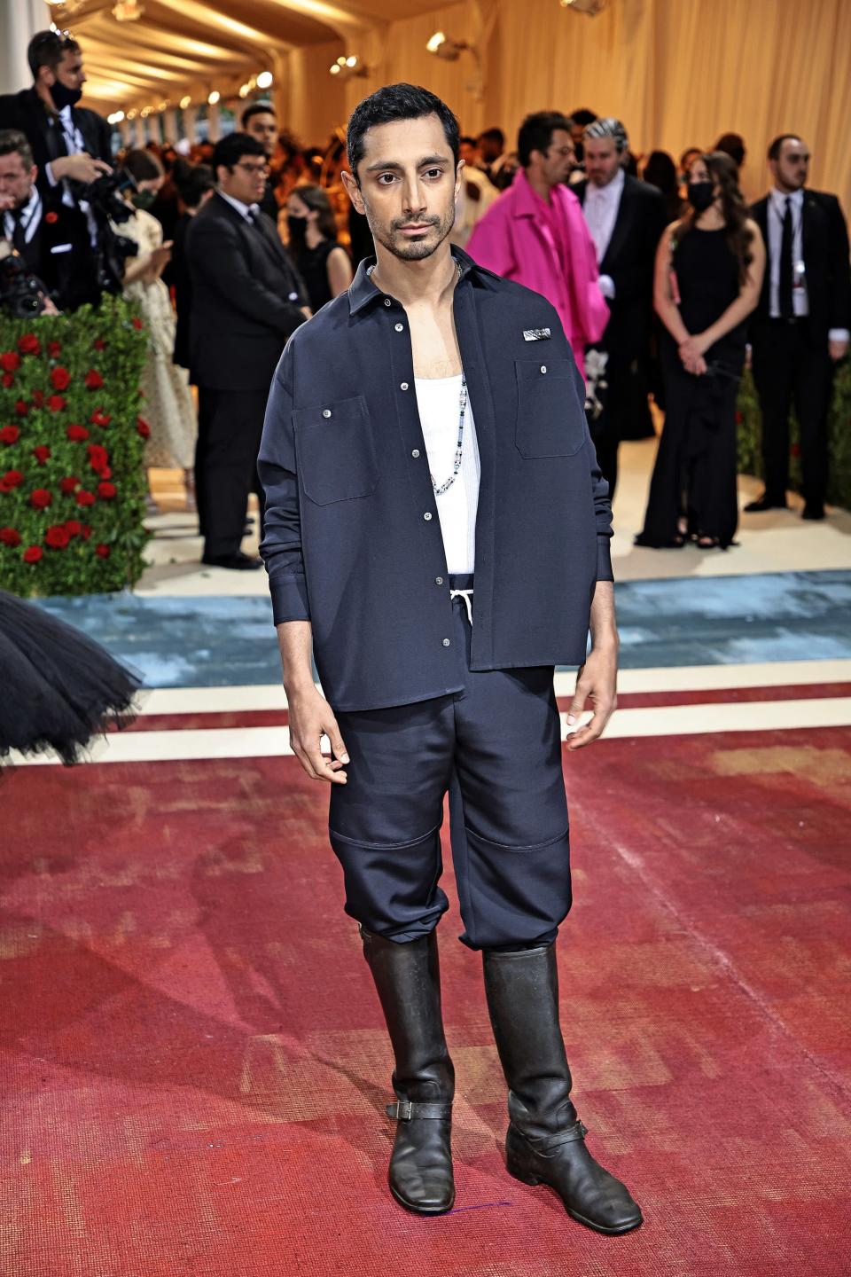 <p>Ahmed took the Met Gala as an opportunity to make a political statement and paid homage to the immigrant workers that kept the Gilded Age alive. While many celebrities represented the golden glitz that made up the Gilded Age, Ahmed wanted to acknowledge the less-than-glamorous reality for immigrants. With his 4SDesigns by Angelo Urrutia navy blue work jacket, leather work boots, and an understated Cartier necklace inspired by Indian culture, Ahmed made sure to honor the background players of the Gilded Age.</p>