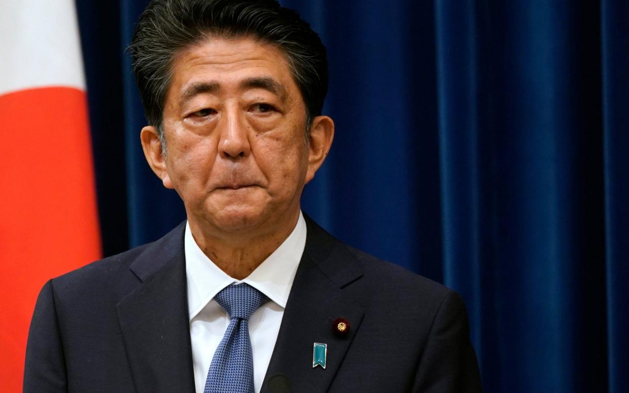 Japanese Prime Minister Shinzo Abe reacts during a press conference at the prime minister official residence - Getty Images AsiaPac 