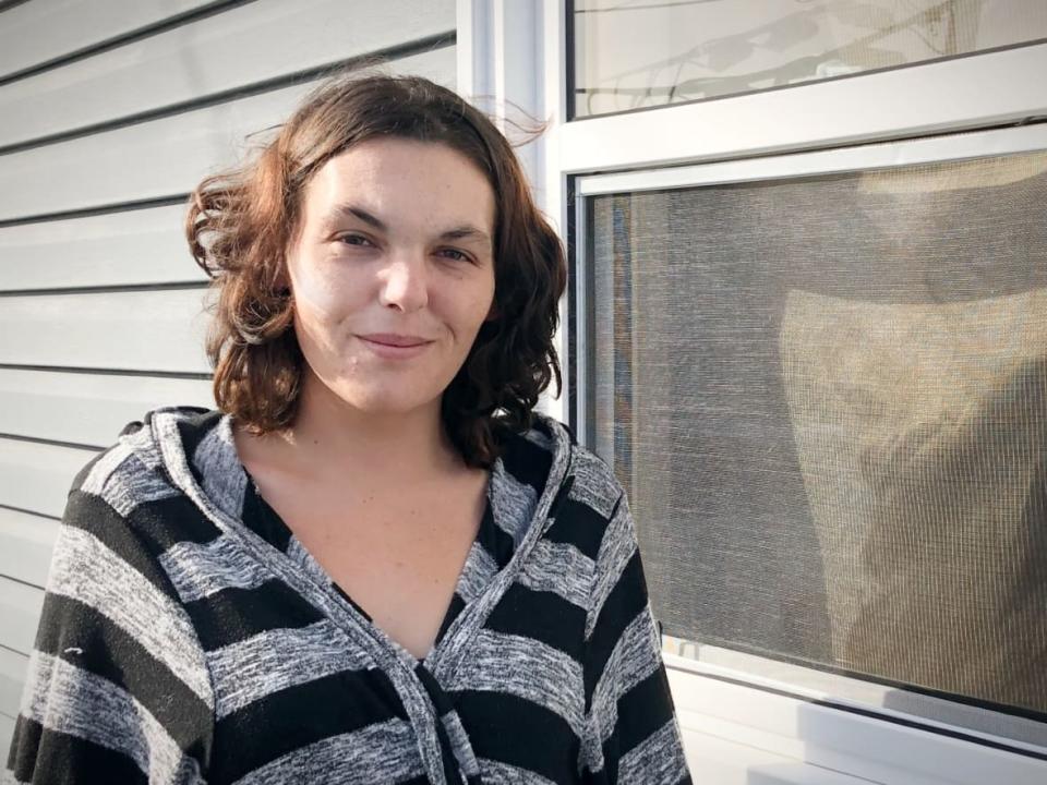 Kathleen Coady, a single mother living in New Waterford, N.S., expected her Canada Child Benefit to go up after having a baby 15 months ago, but says the CERB income she received last year meant a loss of $323 a month in baby bonus this year. (Tom Ayers/CBC - image credit)