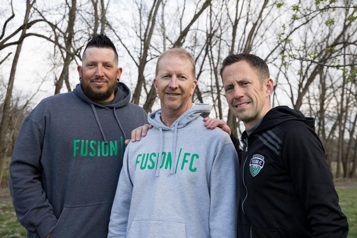 Alex Flamm (left) and Travis Little (right) used what they learned about CPR from Mike Quinn to later save Quinn's life. They are pictured together on March 28, 2023.