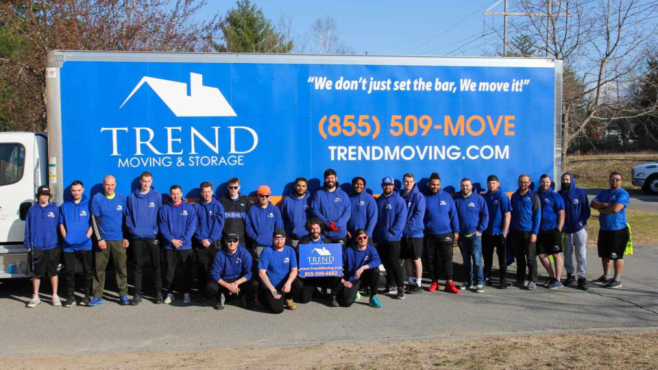 The Trend Moving & Storage team in front of a moving truck