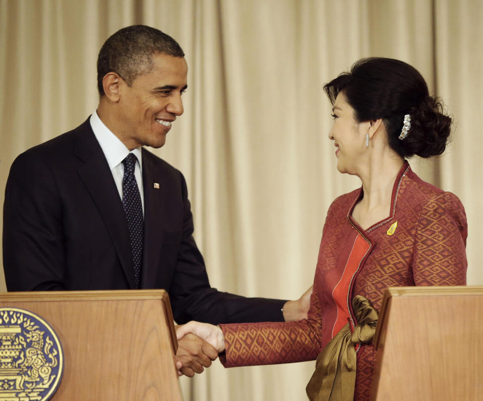 U.S. President Barack Obama, left, and Thai Prime Minister Yingluck Shinawatra shake hands following the conclusion of their joint news conference at Thai Government House in Bangkok, Thailand, Sunday, Nov. 18, 2012.