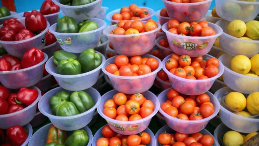 Bowls of colorful fruits and vegetables.