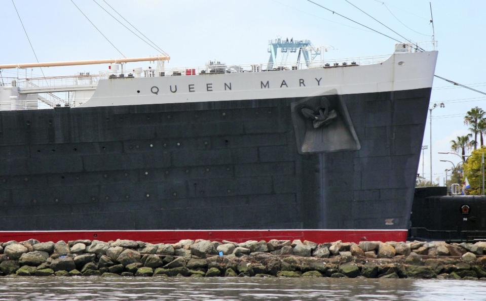 This May 15, 2015 photo shows the retired Cunard ocean liner Queen Mary at its permanent mooring in the harbor at Long Beach, Calif. A survey has found the ship is so corroded that it's at urgent risk of flooding, and the price tag for fixing up the 1930s ocean liner could near $300 million. Documents obtained the Long Beach Press-Telegram show it would take five years to rehab the ship. Engineers who compiled the survey warn that the vessel is probably "approaching the point of no return." (AP Photo/John Antczak)