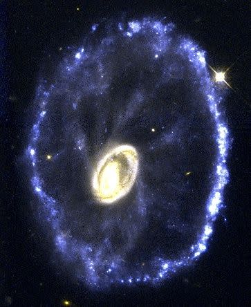 Located 500 million light-years away in the constellation Sculptor, the galaxy looks like a wagon wheel. The galaxy's nucleus is the bright object in the center of the image; the spoke-like structures are wisps of material connecting the nucleus to the outer ring of young stars. The galaxy's unusual configuration was created by a nearly head-on collision with a smaller galaxy about 200 million years ago. (Photo: via Curt Struck and Philip Appleton (Iowa State University), Kirk Borne (Hughes STX Corporation), and Ray Lucas ( Space Telescope Science Institute), and NASA/ESA)