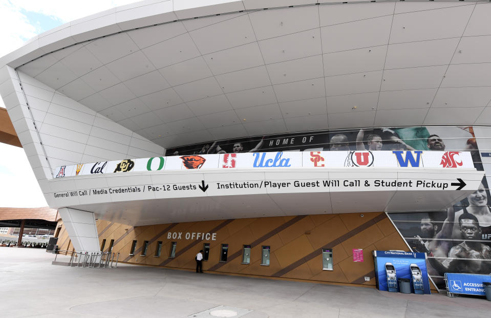 Pac-12 logos outside of a basketball arena box office.