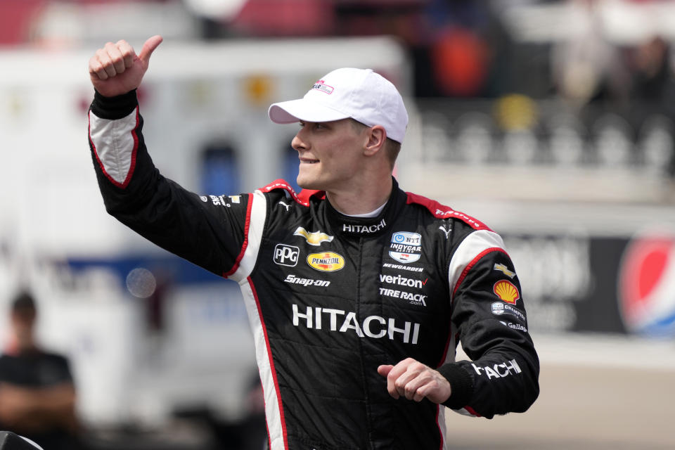 Josef Newgarden reacts to fans after winning an IndyCar Series auto race, Sunday, July 23, 2023, at Iowa Speedway in Newton, Iowa. (AP Photo/Charlie Neibergall)