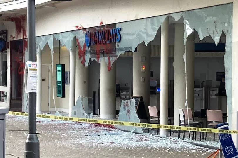 A branch's smashed windows in Bristol -Credit:PA