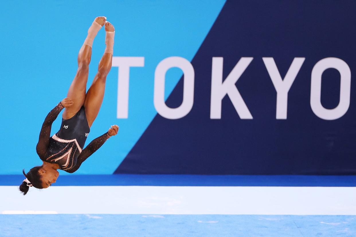 Simone Biles flips at the Tokyo Olympics.