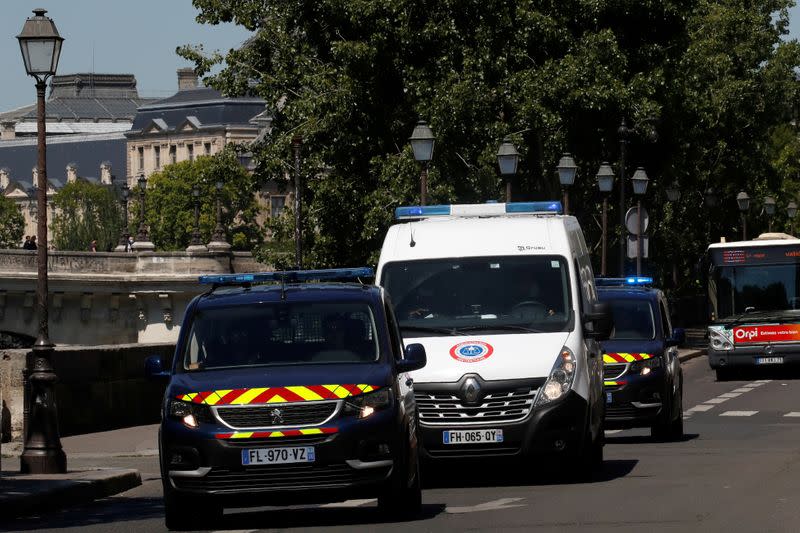 A police convoy believed to be carrying Rwandan genocide fugitive Felicien Kabuga arrives at the Paris courthouse