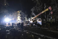 Emergency workers clear the rubble after a Russian rocket hit an apartment building in Kramatorsk, Ukraine, on Thursday, Feb. 2, 2023. At least 3 people were killed and 21 wounded in the attack. (AP Photo/Yevgen Honcharenko)