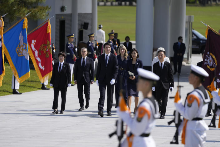 Canadian Prime Minister Justin Trudeau, center, arrives at the National Cemetery in Seoul, South Korea, Wednesday, May 17, 2023. (AP Photo/Lee Jin-man, Pool)