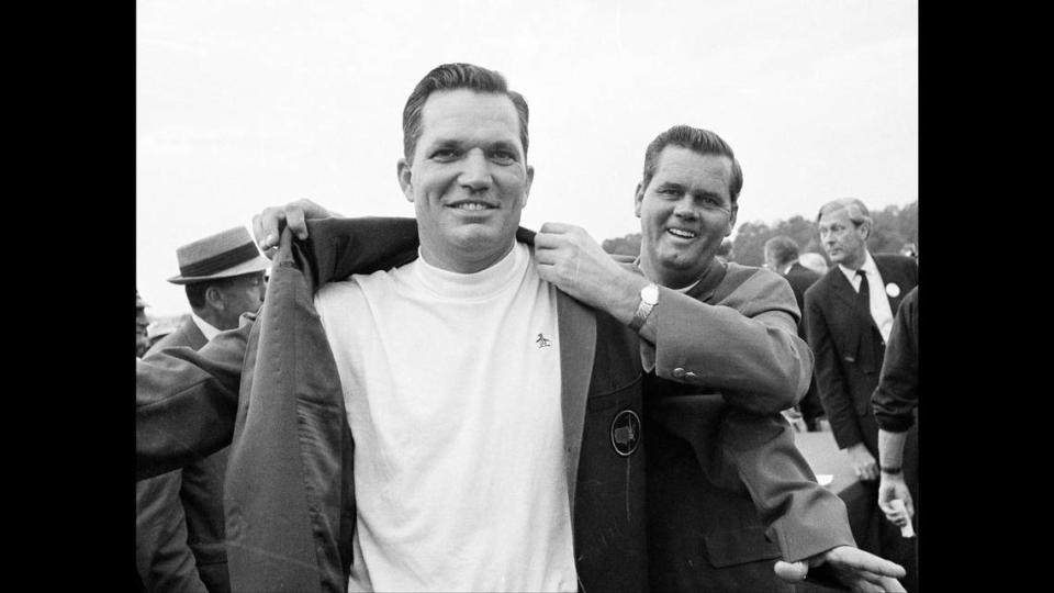 Bob Goalby tries on the coveted Green Jacket as winner of the 1968 Master’s Tournament championship.