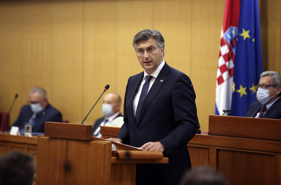 Croatia's Prime Minister incumbent Andrej Plenkovic presents his new government's plan before the Croatian Parliament in Zagreb, Croatia Thursday, July 23, 2020. Parliament vote on Croatian new government is expected later in the day. (AP Photo/Daniel Kasap)
