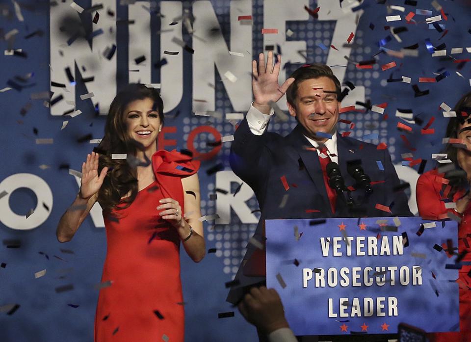 Ron DeSantis and his wife Casey celebrate after winning the Florida Governor's race during DeSantis' party at the Rosen Centre in Orlando on Orlando, Fla., on Tuesday, Nov. 6, 2018. (Stephen M. Dowell/Orlando Sentinel via AP)