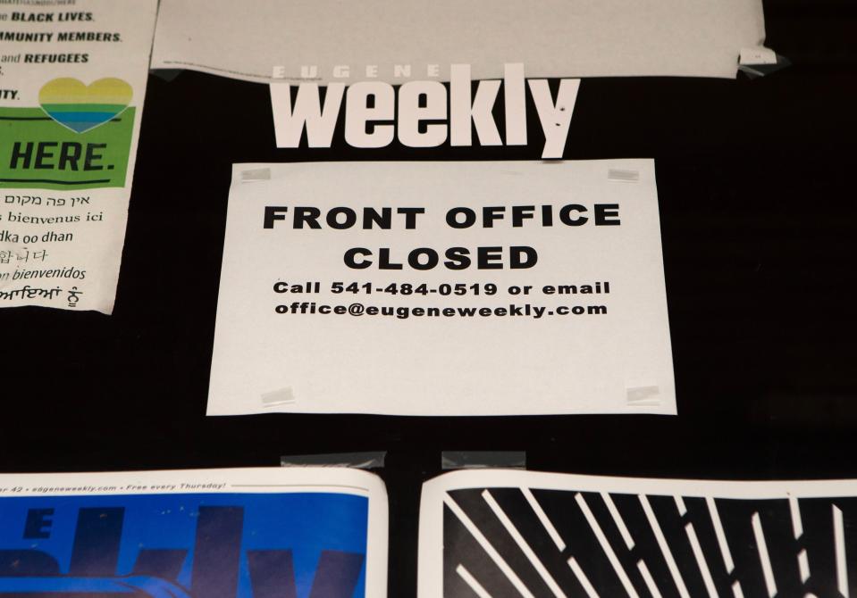 A sign on the door of the Eugene Weekly in Eugene.