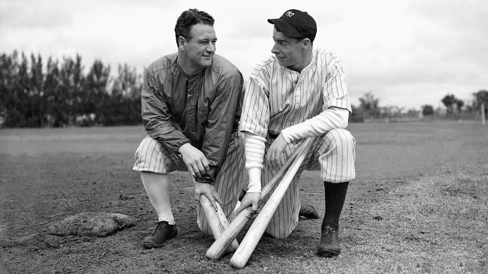 Mandatory Credit: Photo by AP/Shutterstock (6673608a)Lou Gehrig; Joe DiMaggio Lou Gehrig, left, gets something like a smile from rookie sensation Joe DiMaggio during spring training in St.