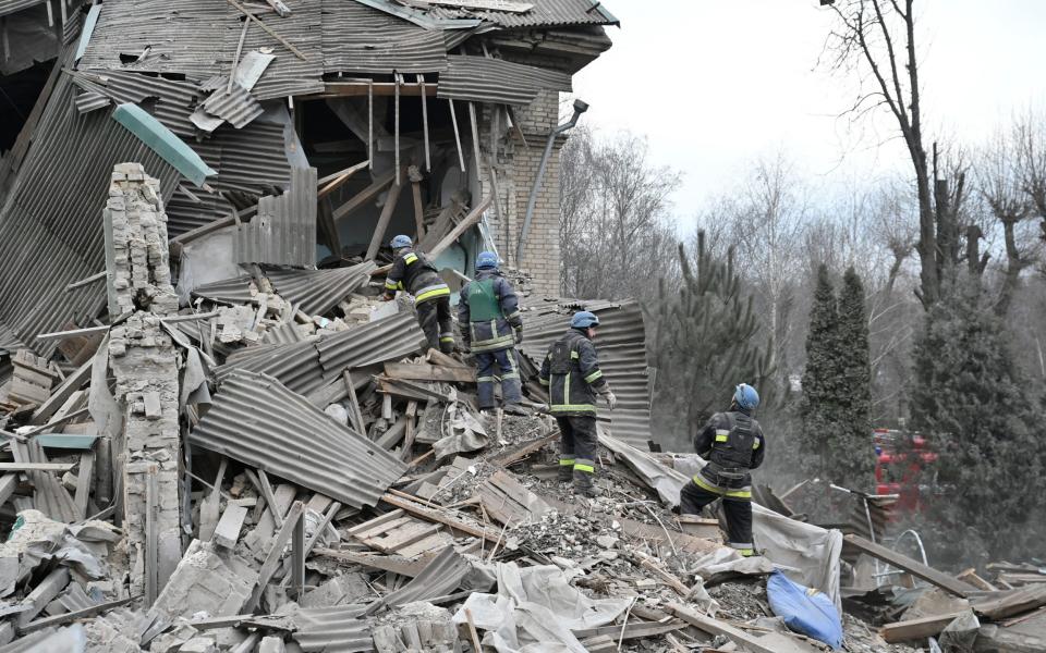 Rescuers work at the site of a maternity ward of a hospital destroyed by a Russian missile attack, as their attack on Ukraine continues, in Vilniansk, Zaporizhzhia region - Reuters