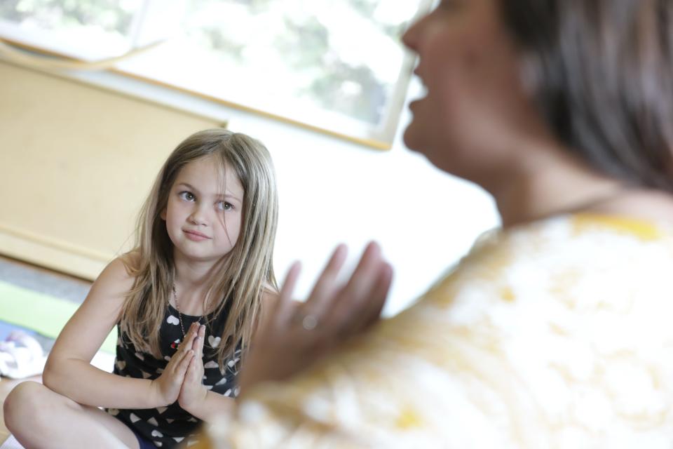 Hartley participates in a yoga class at Fox Valley Montessori Academy Monday, May 22, 2023, in Appleton, Wis.