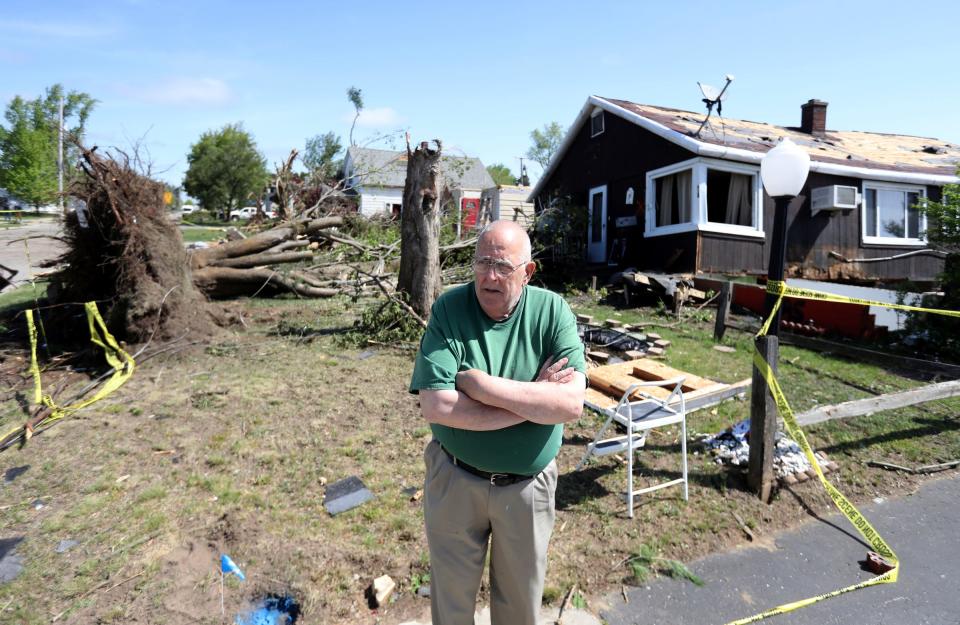 Gaylord city councilman Vic Ouellette stands in front of what's left of his childhood home on Otsego street. Residents of Gaylord assess damage after a tornado hit a section of the town Saturday, May 21, 2022.