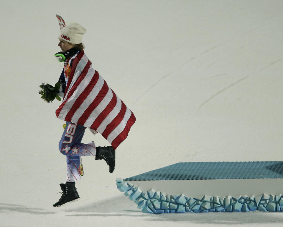 Women's gold medalist, United States' Mikaela Shiffrin, leaves the podium after the flower ceremony for the women's slalom at the Sochi 2014 Winter Olympics, Friday, Feb. 21, 2014, in Krasnaya Polyana, Russia. (AP Photo/Charlie Riedel)