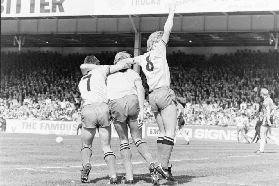 Watford Observer: Nigel Callaghan and Mo Johnston mob George Reilly after scoring