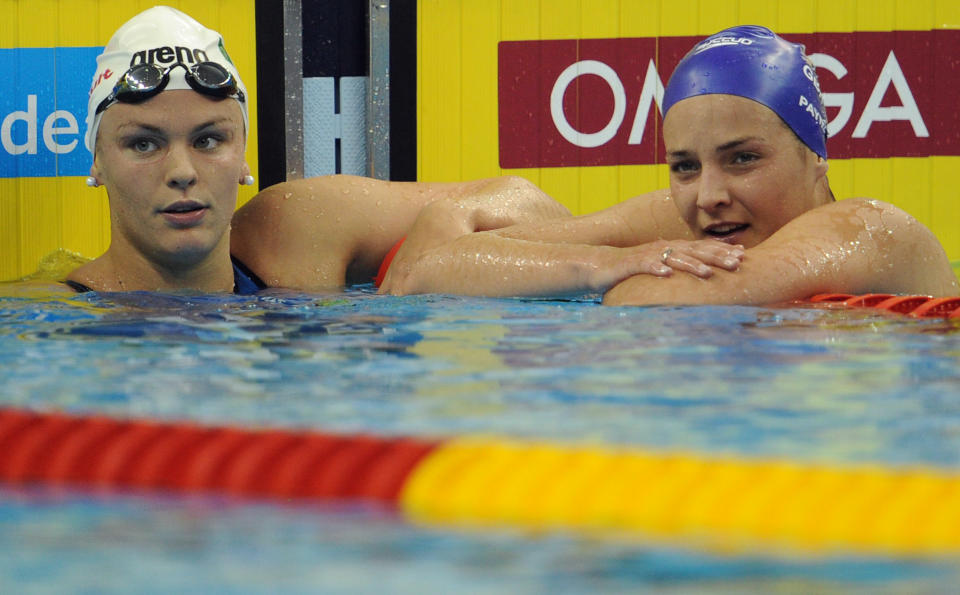 Ireland's Grainne Murphy (L) and Britain's Keri-Anne Payne talk after they competed in the heats of the women's 1,500-metre freestyle swimming event in the FINA World Championships at the indoor stadium of the Oriental Sports Center in Shanghai on July 25, 2011.  AFP PHOTO / MARK RALSTON (Photo credit should read MARK RALSTON/AFP/Getty Images)