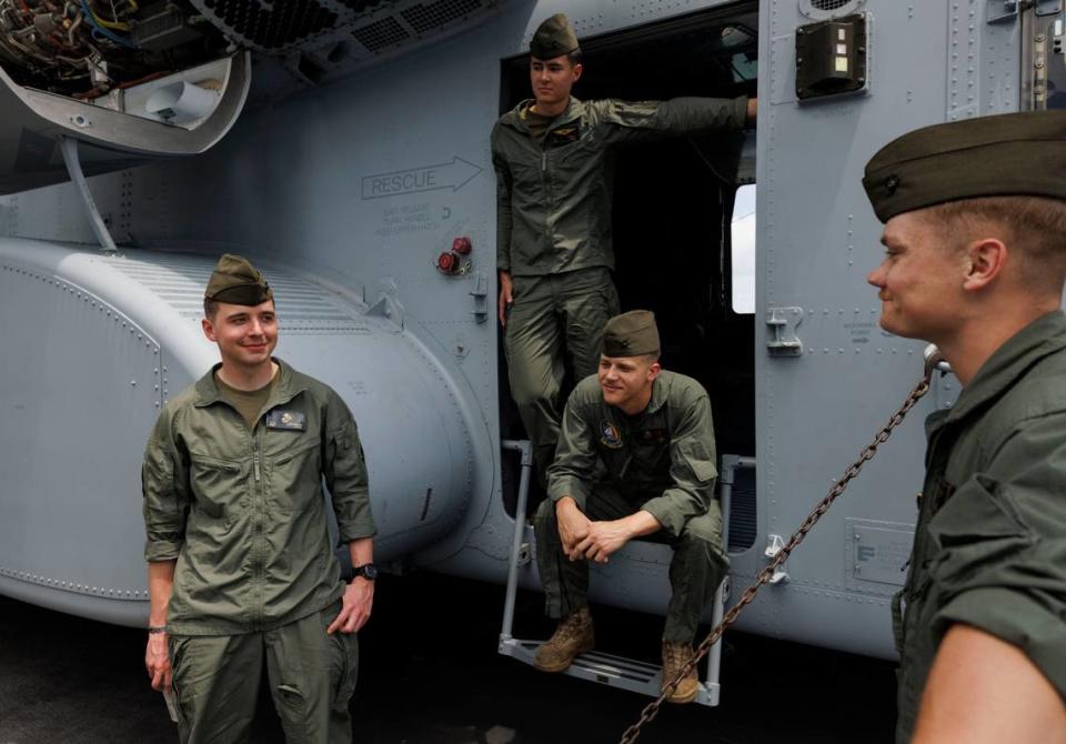 Members of a heavy marine helicopter squadron talk outside the CH-53K super stallion helicopter during the opening day of Fleet Week on Monday, May 6, 2024, at Norwegian Cruise Lines Terminal in PortMiami. Alie Skowronski/askowronski@miamiherald.com