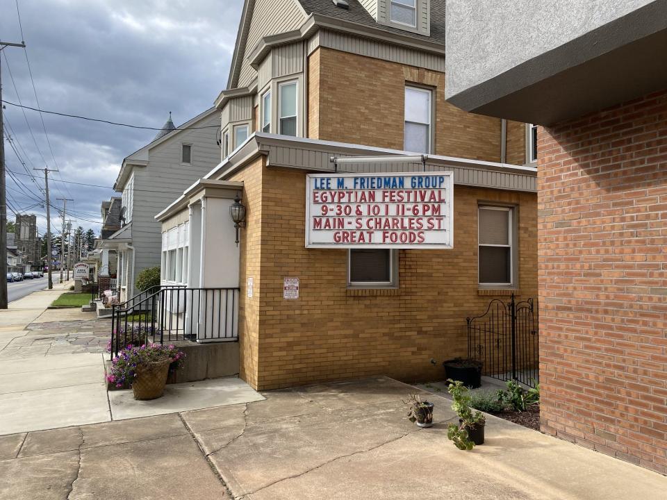 A sign on Dallastown’s Main Street – Route 74 – tells about the annual food festival at nearby Archangel Michael and St. Karas Coptic Orthodox Church.