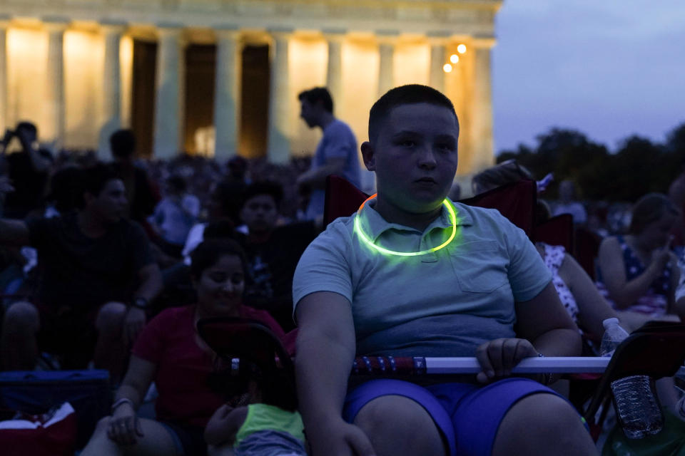 <p>A boy sits near the Lincoln Memorial prior to a firework show during the 4th of July Independence Day celebrations at the National Mall in Washington, D.C.,July 4, 2018. (Photo: Toya Sarno Jordan/Reuters) </p>