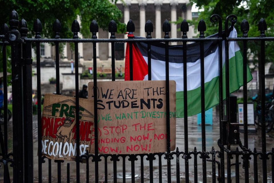 Palestinian flags and protest banners are displayed at an entrance to UCL London on May 6 (Getty Images)