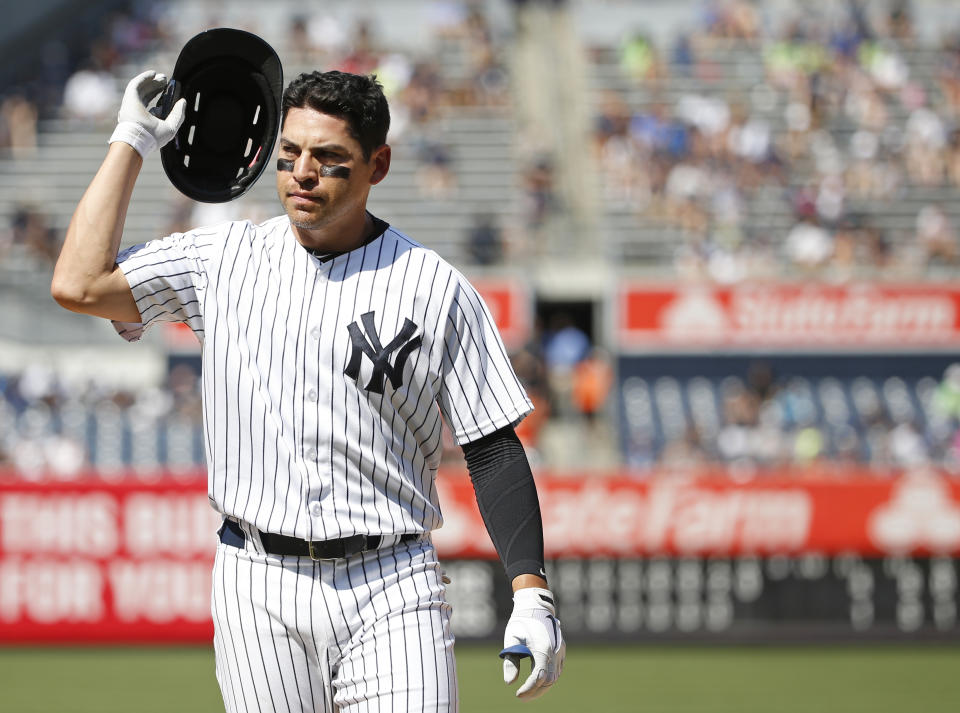 New York Yankees Jacoby Ellsbury (22) reacts as he removes his helmet after flying out to center field with a runner on first during the eighth inning of a baseball game against the Baltimore Orioles in New York, Thursday, July 21, 2016. (AP Photo/Kathy Willens)