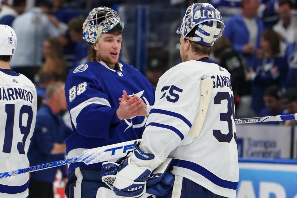 Tampa Bay Lightning goaltender Andrei Vasilevskiy (left) and Toronto Maple Leafs goaltender Ilya Samsonov  greet each other after Game 6.